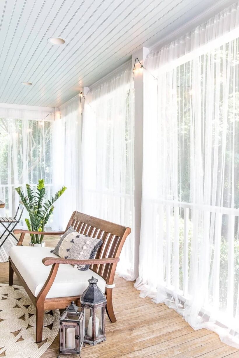 porch with sheer privacy curtains