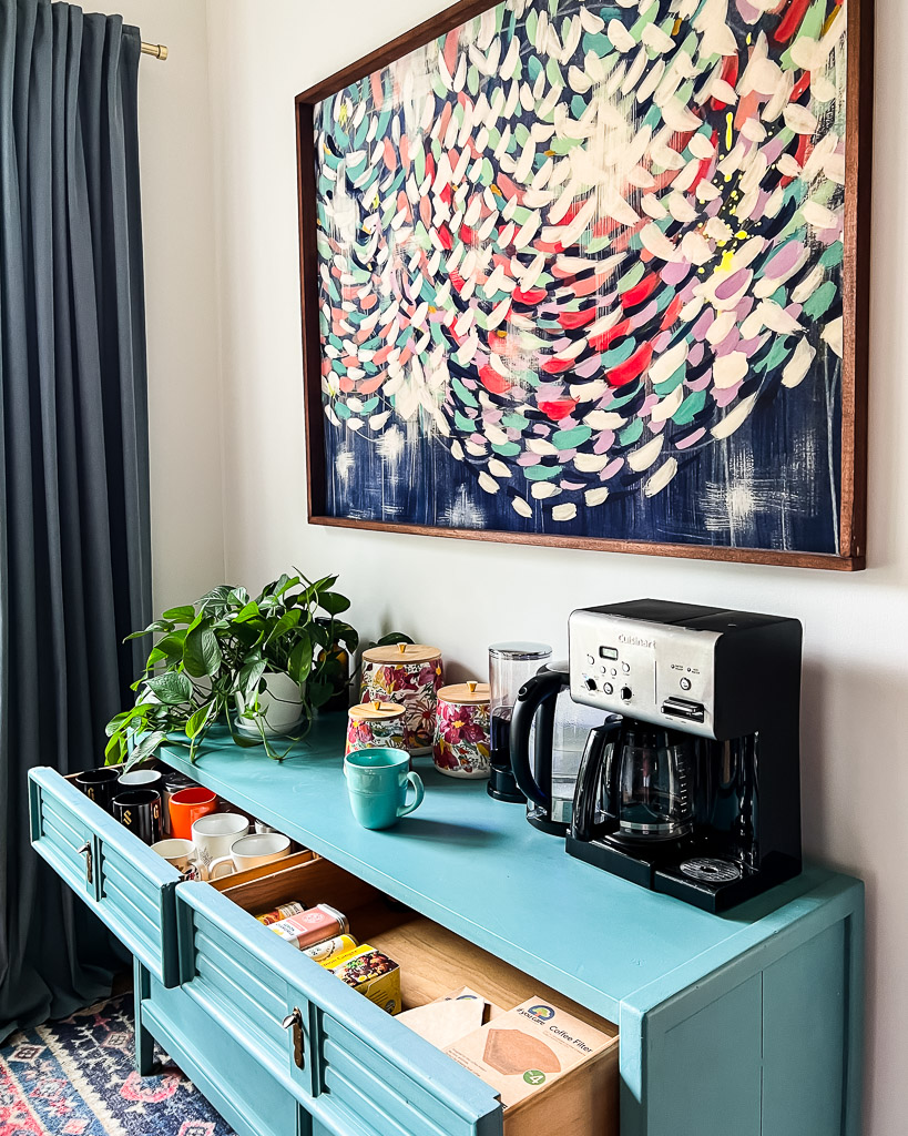 coffee nook with dresser and colorful art
