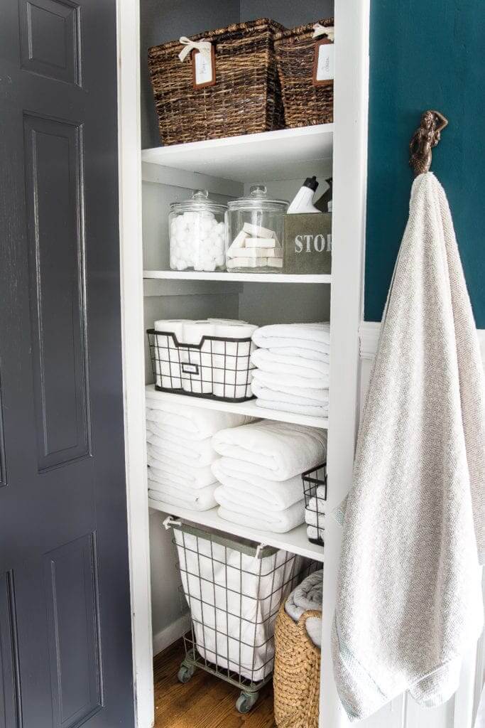 well organized bathroom linen closet 