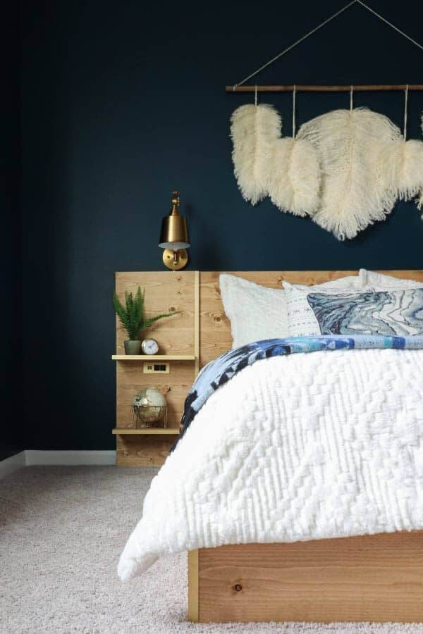 moody navy walls with platform bed