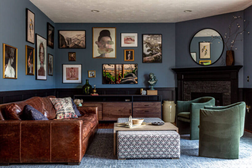 moody blue gray painted walls with gallery art