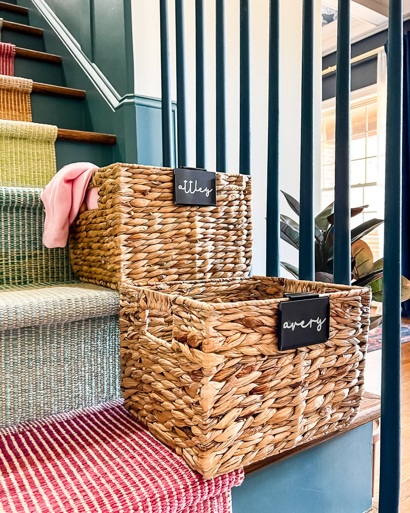 name labels made with Cricut Joy for water hyacinth baskets on stairs