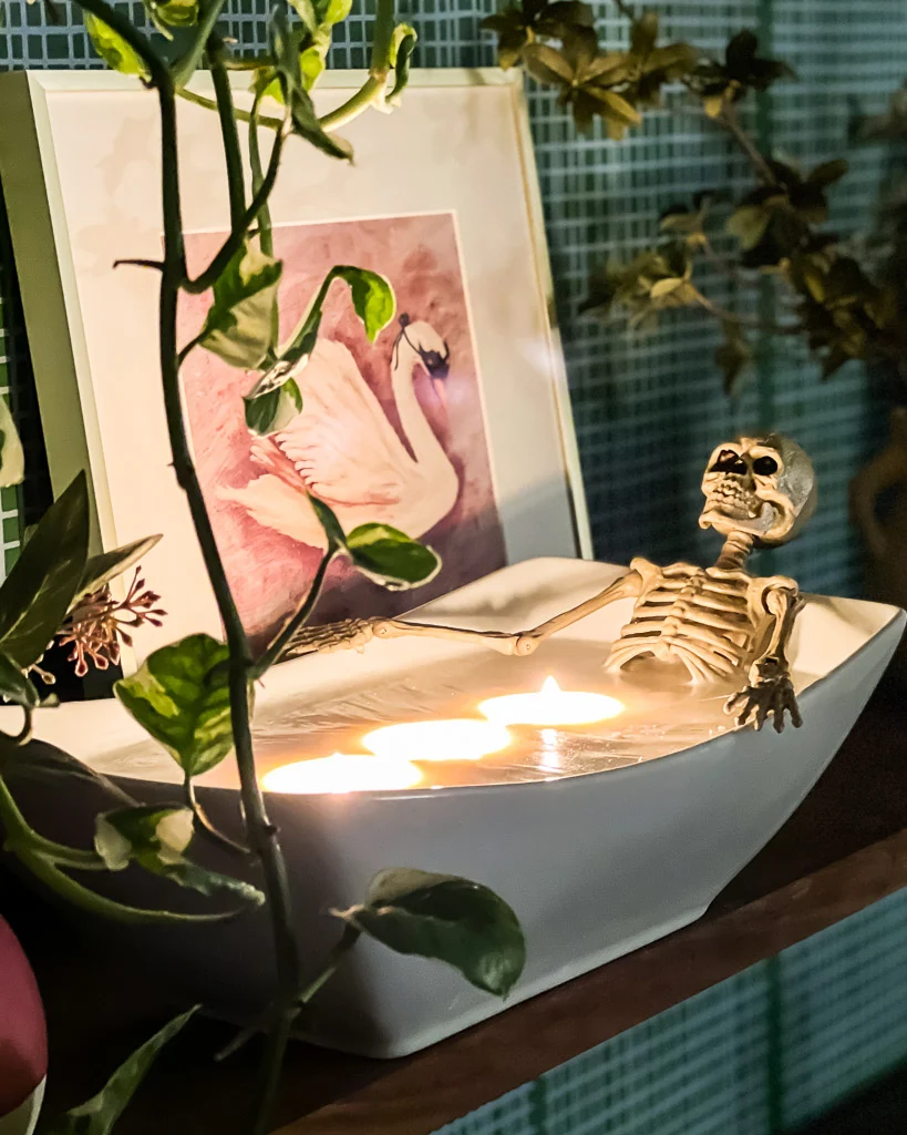 diy halloween candle skeleton in a bathtub