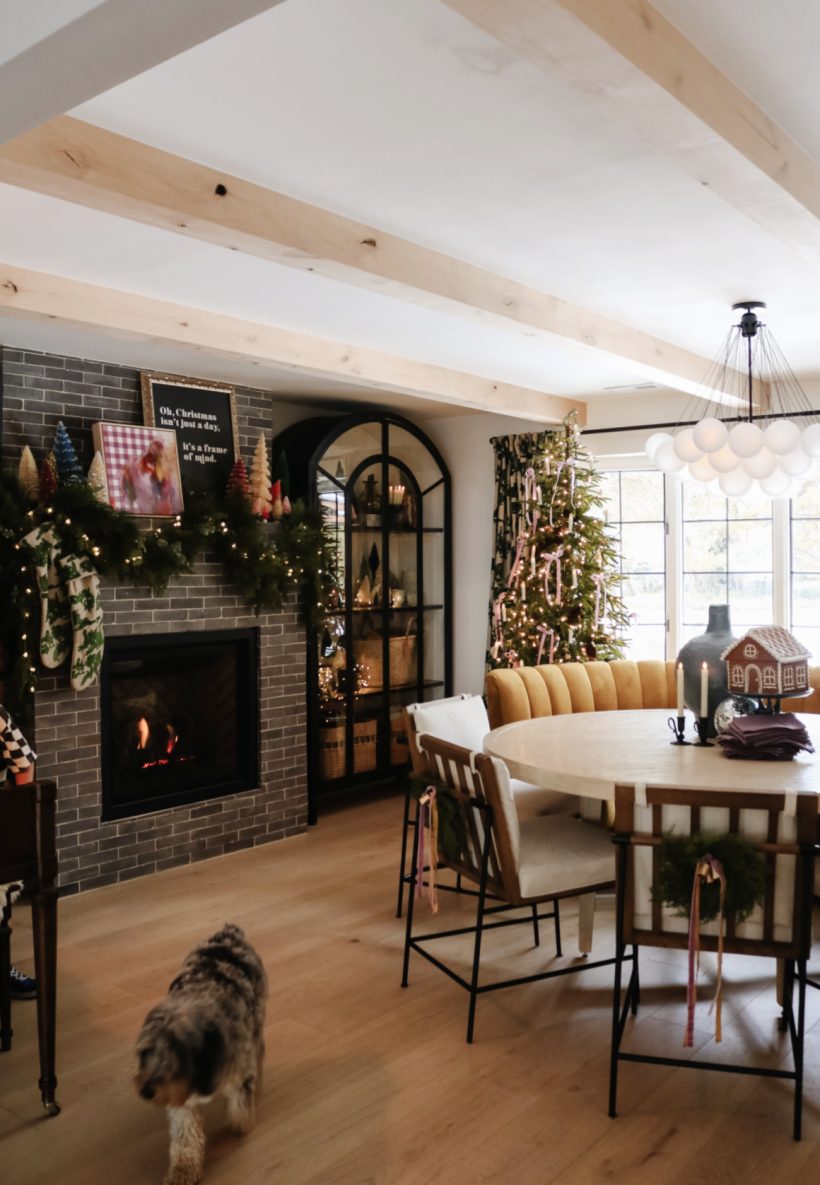 christmas decorations in dining room with tree and fireplace