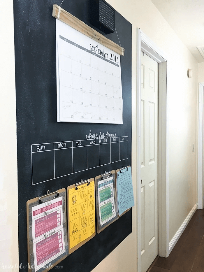 rustic command center with weekly chalk calendar and monthly paper calendar
