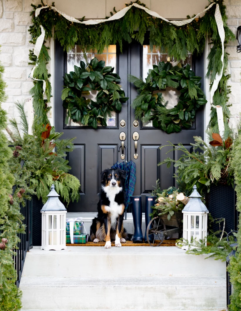 greenery covered front porch by Craftberry Bush