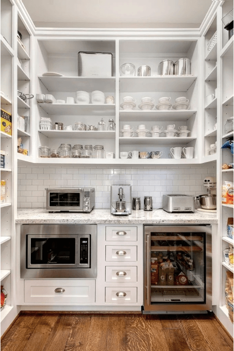 walk-in pantry with countertop for coffee and small work space