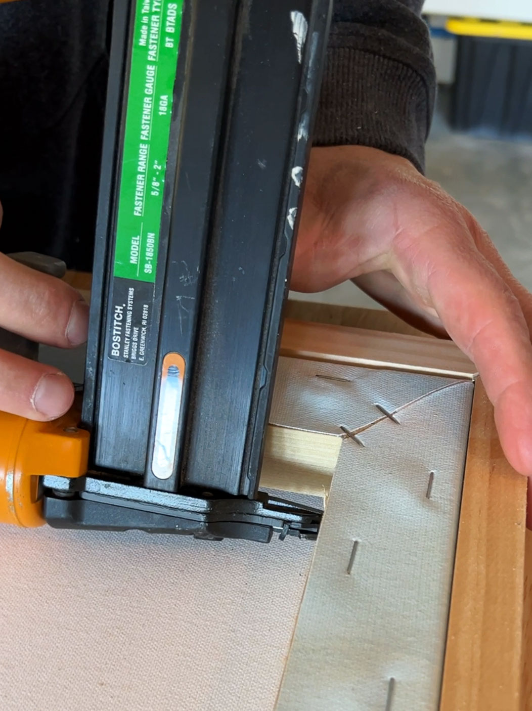 attaching canvas to flush mount frame with nail gun