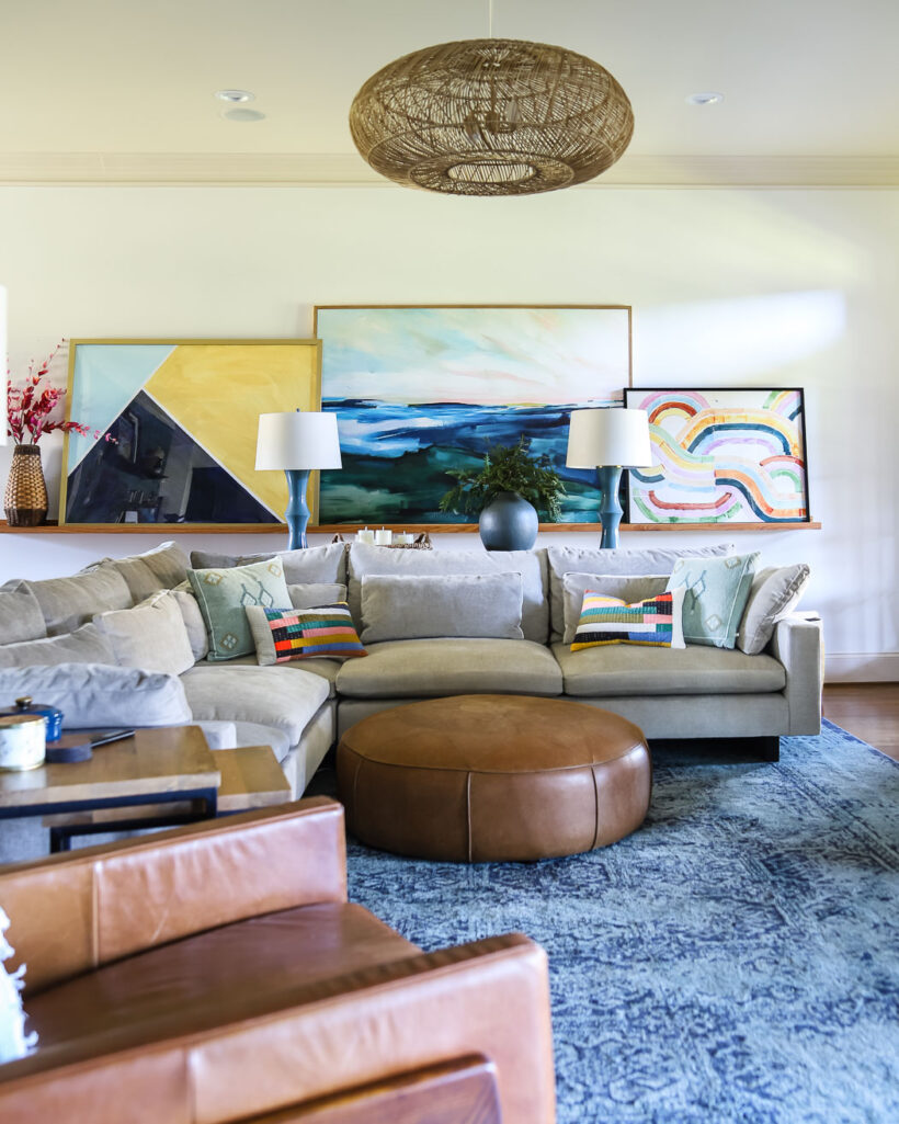 colorful family room with large canvas art surrounded by DIY frame
