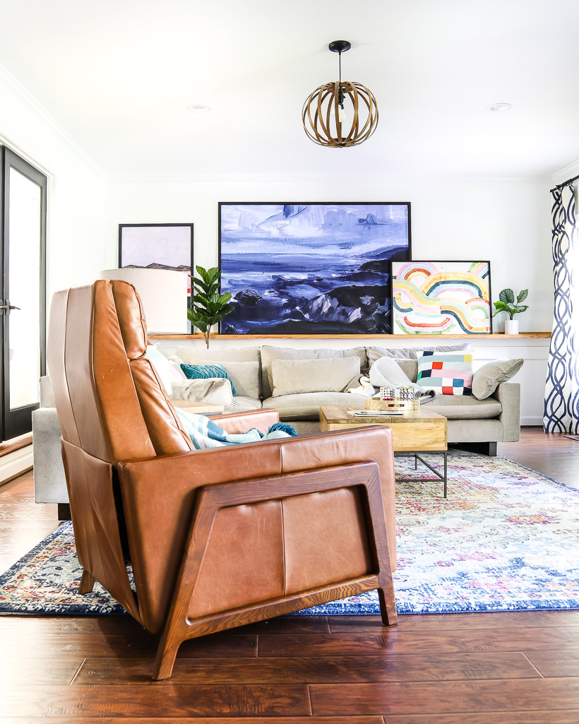 leather West Elm Spencer recliner in colorful family room