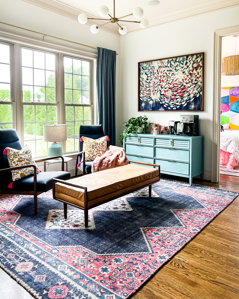 colorful sitting area with coffee station and West Elm rug