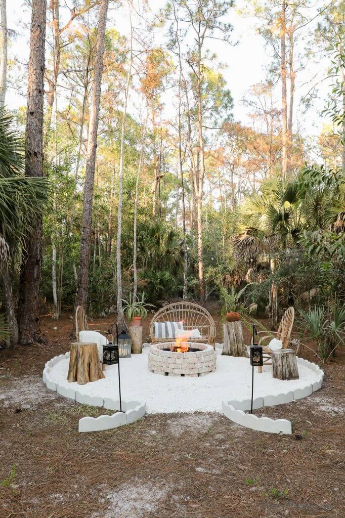 white gravel firepit in wood with smokeless fire pit