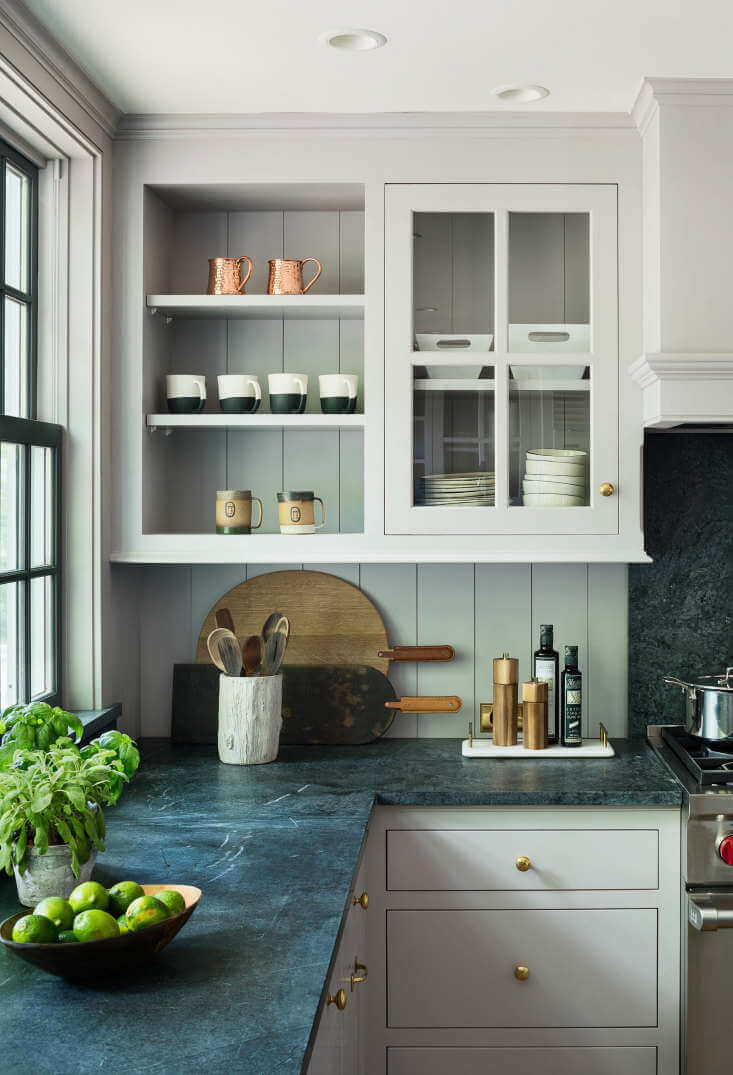 Dove Tale by Farrow and Ball on kitchen cabinets with green countertops and open shelving