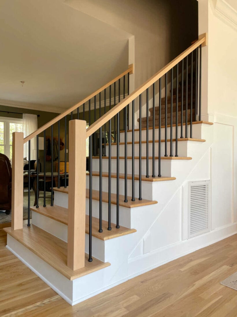 modern staircase makeover changing the lines of the bottom step and bannister