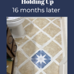 photo of bathroom floor with text that says how our tile stickers are holding up 16 months later