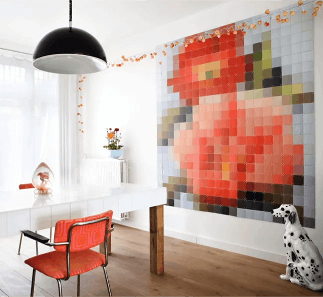 giant pixel flower art made of color squares in dining room