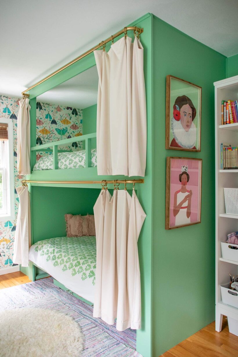 DIY green built-in bunk beds in girls bedroom with moth wallpaper