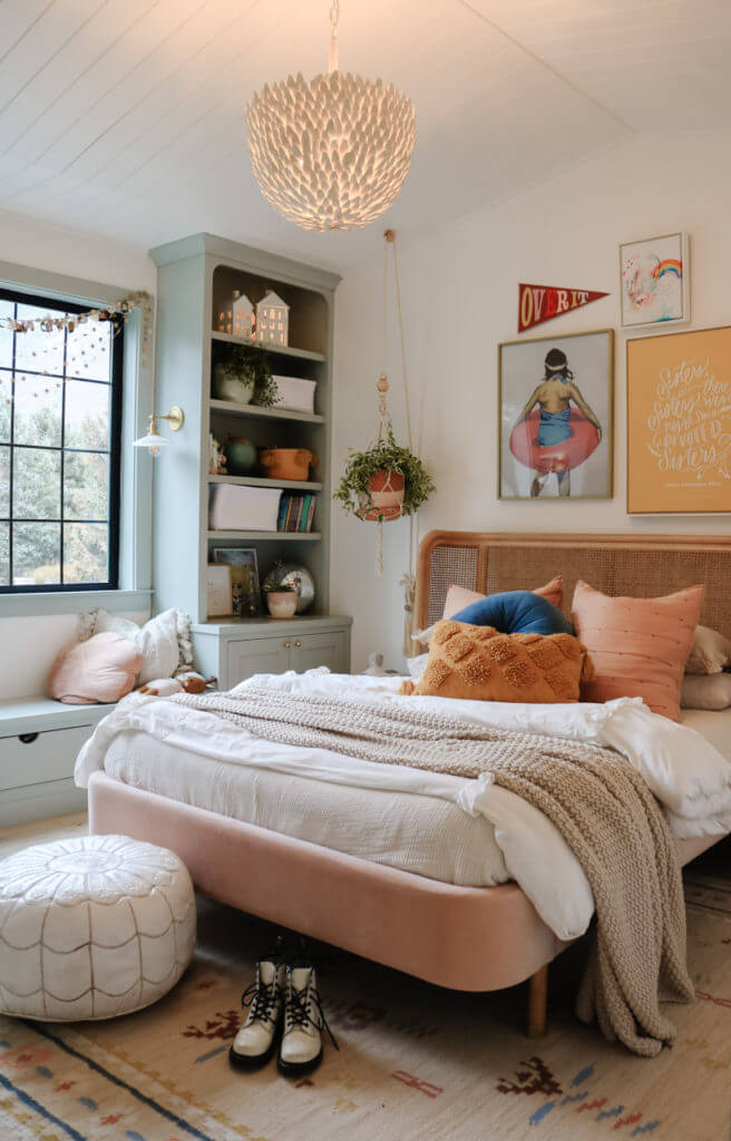 teen girl bedroom with velvet and can bed, mint window seat and book shelves and planked ceiling
