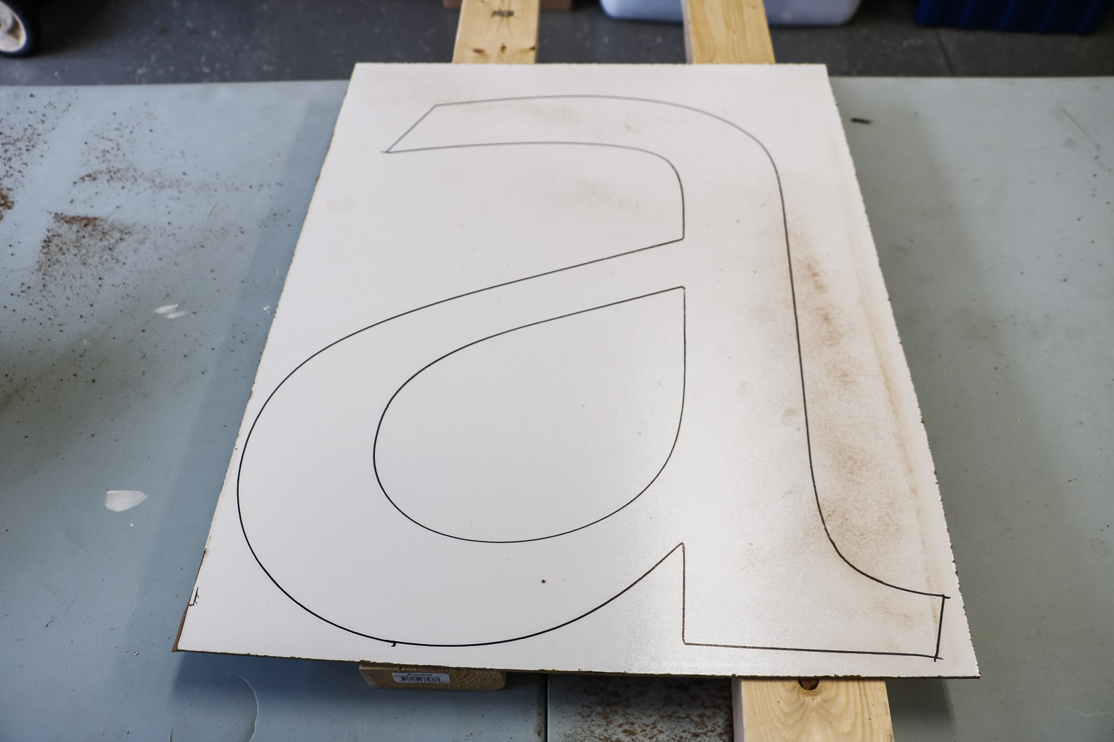 large letter A traced on wood