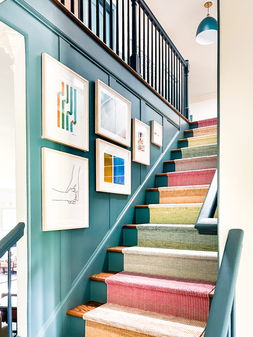 colorful art hanging in staircase