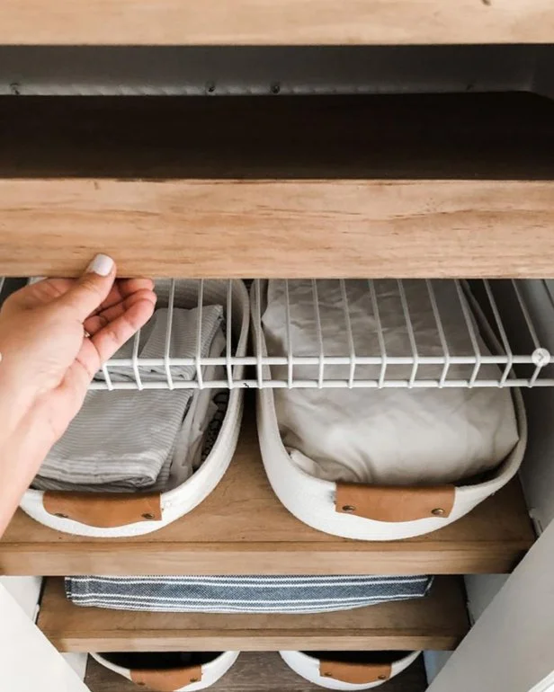 photo of DIY wood shelves covering wire shelving in linen closet