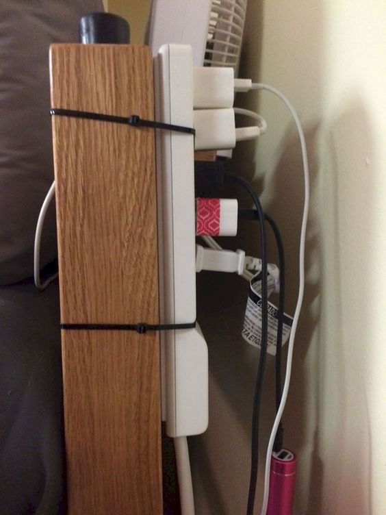 charging strip attached to bed post dorm room hack