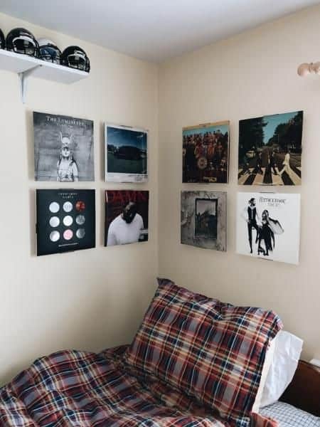 dorm with framed album covers as art
