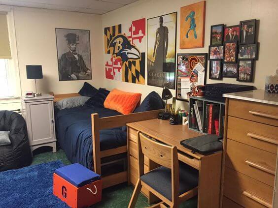 guy's dorm room with posters and neat desk