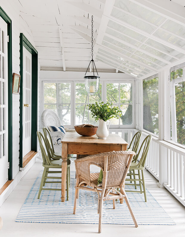 screened-in porch with vintage dining table and chairs