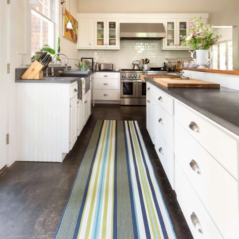 striped indoor outdoor rug used as kitchen runner