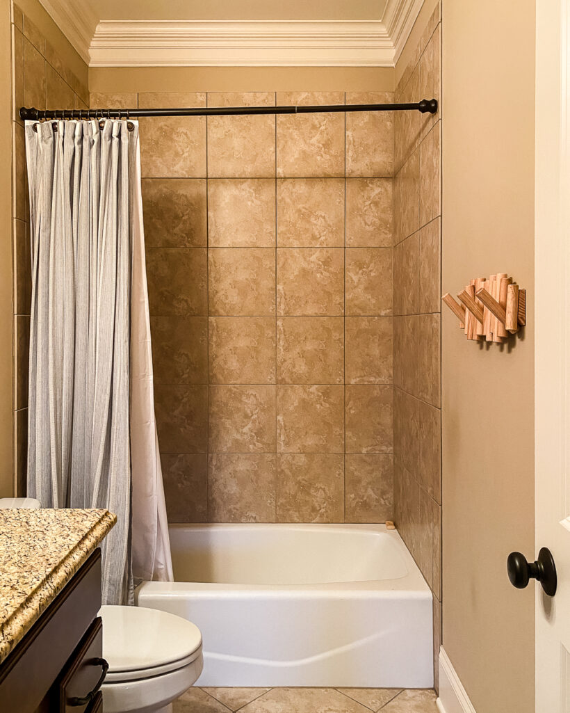outdated bathroom with brown tile