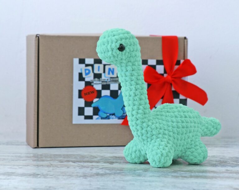crochet kit to make small teal dinosaur