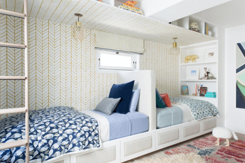 built in twin beds in blue and gold shared girls' room 