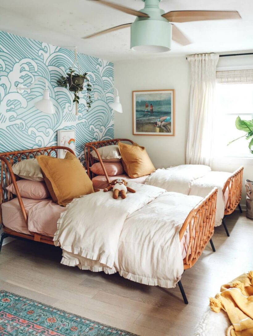 boho wood beds with blue wave wallpaper and neutral bedding