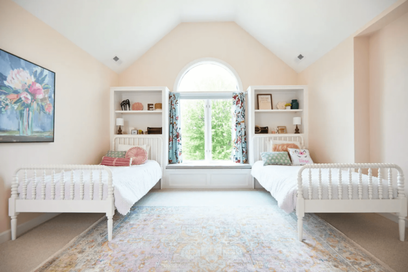 blush bedroom with white Jenny Lend beds and floral painting