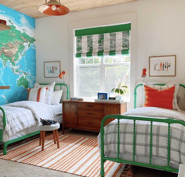 shared bedroom with map mural and green wood beds