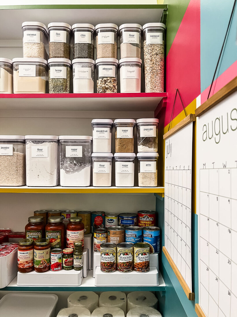 organized canned goods and decanted dry goods in colorful pantry makeover