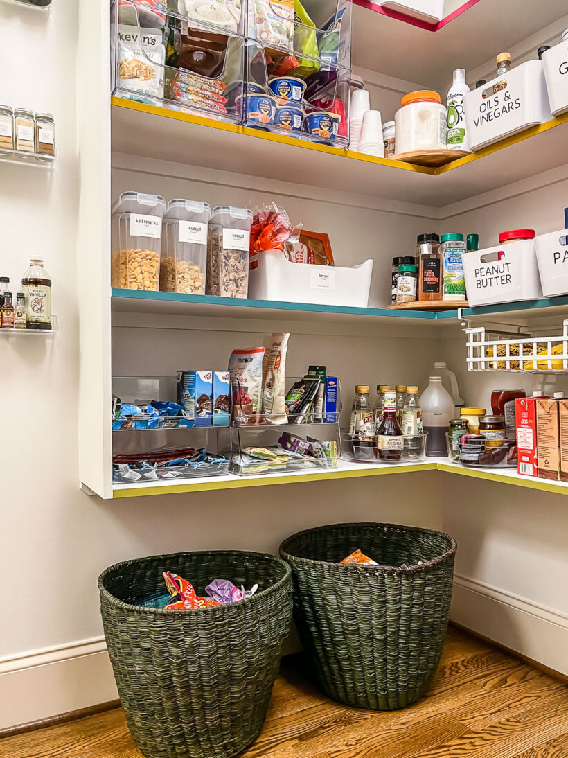 floor baskets to hold extra dry goods in walk-in pantry