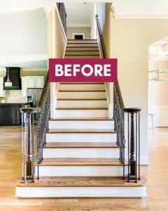 photo of builder-grade staircase with iron railing before makeover