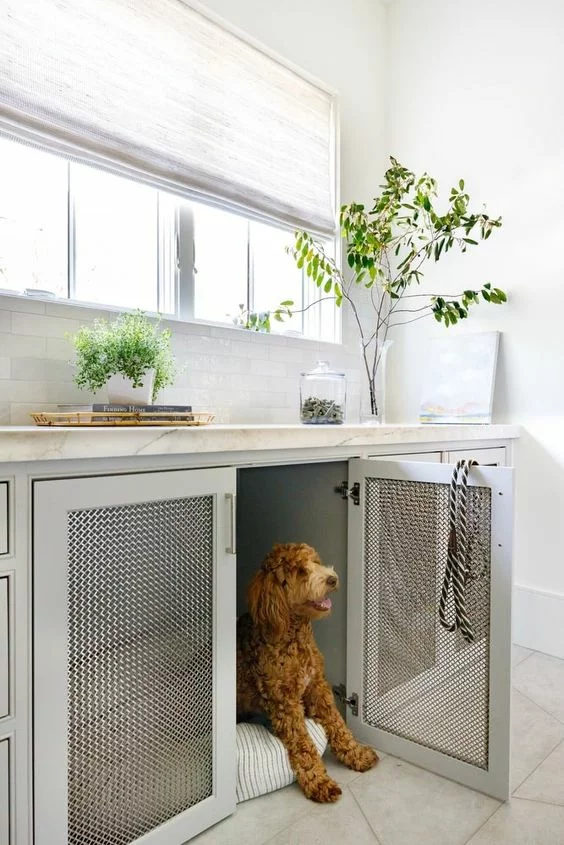 built-in dog crate in mudroom