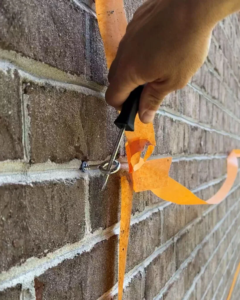 installing screw eye hook into exterior brick wall for DIY wire trellis